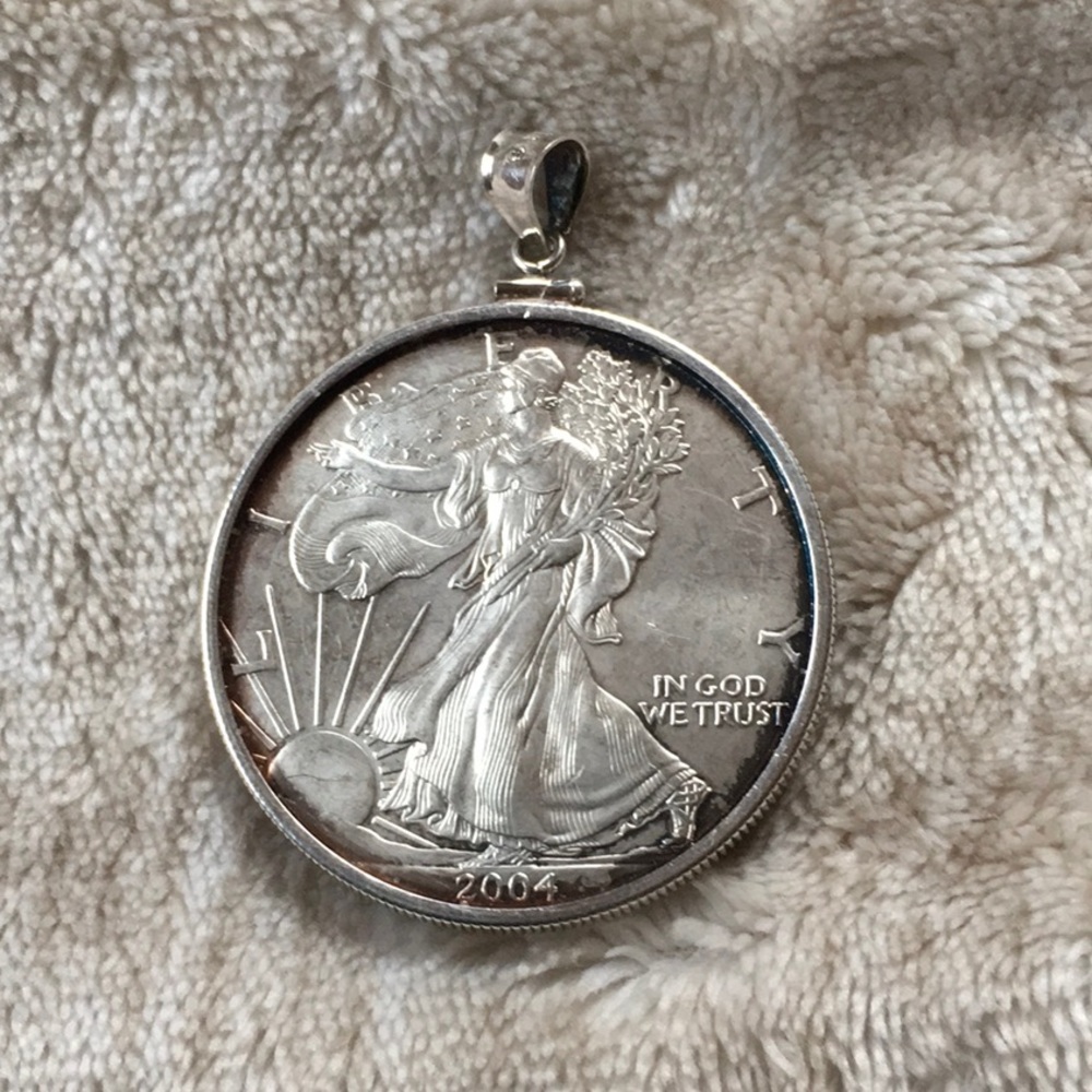 Authentic 2004 Silver Dollar Pendant.